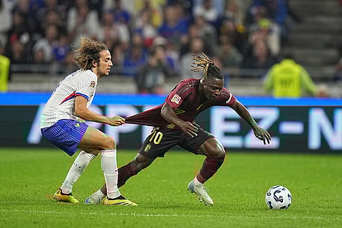 2024–25 UEFA Nations League, France vs Belgium: France's Matteo Guendouzi, left, tries to stop Belgium's Jeremy Doku